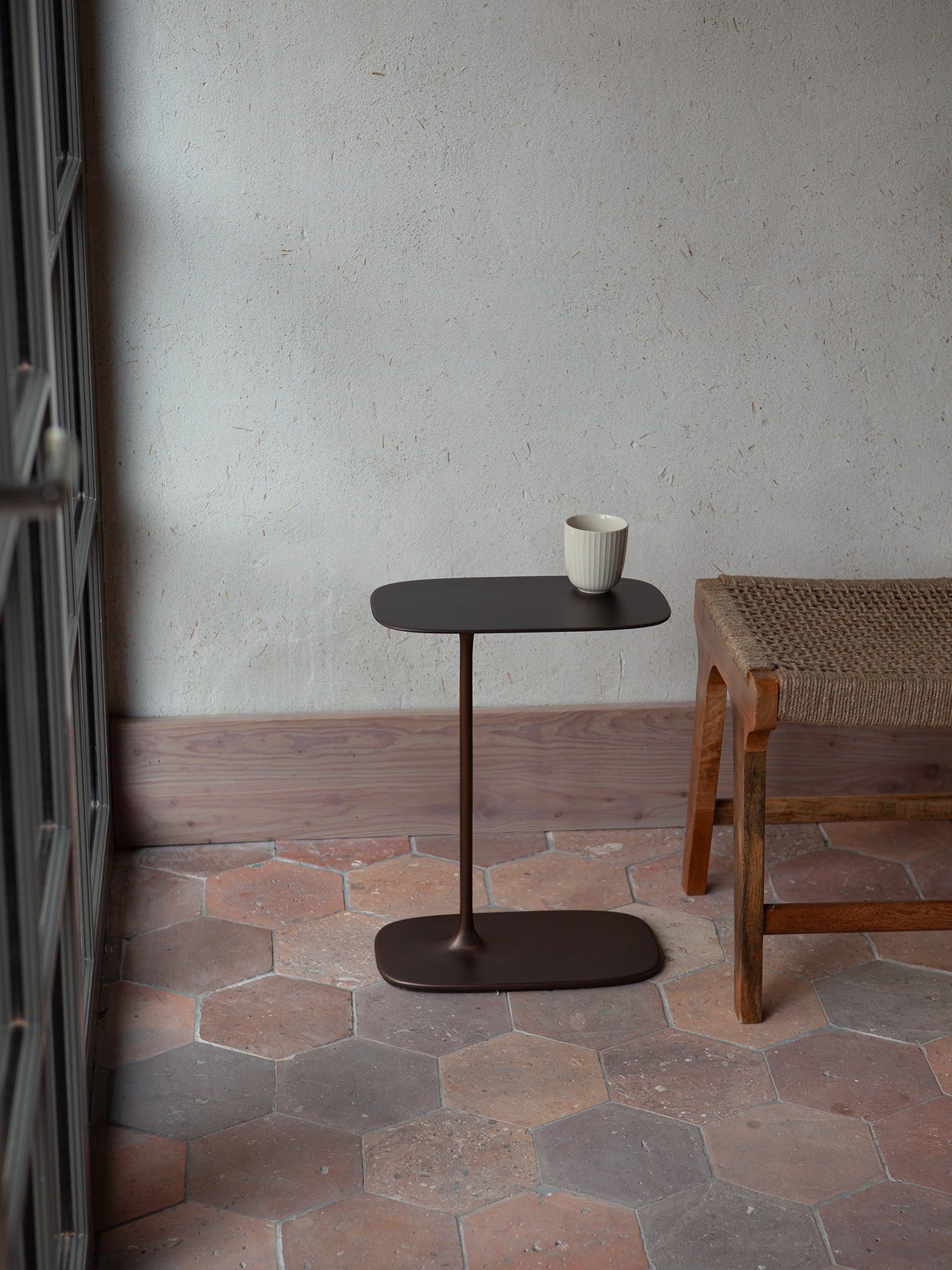 Authentic oxidation and hand-applied weathering on the low aged brass Fluid end table.